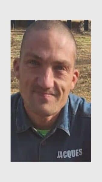face of a man with short shaven hair