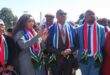 people with SA flag scarves