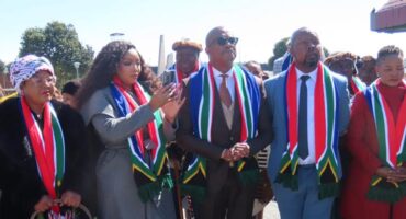 people with SA flag scarves