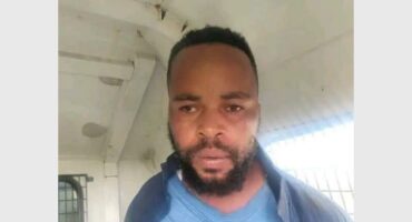 face of suspect in a police van