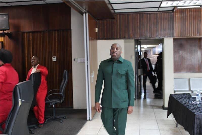 a man in a green suit