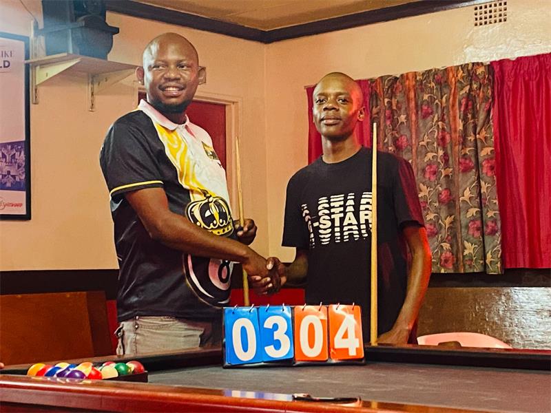 Two men at a pool table
