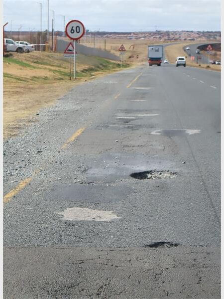 a road riddled with potholes