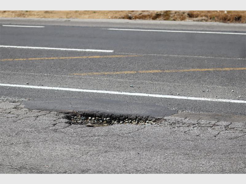 a road riddled with potholes