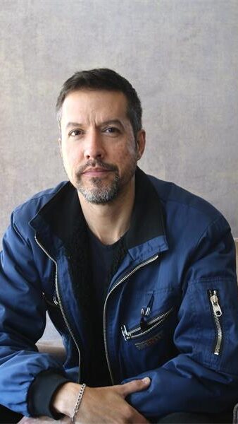 portrait photo of a man with a blue jacket