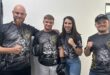 four people showing their fists