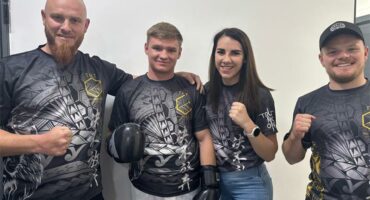 four people showing their fists