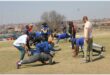 a group of people exercising on a soccer field