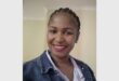 a woman with braids and a demin jacket