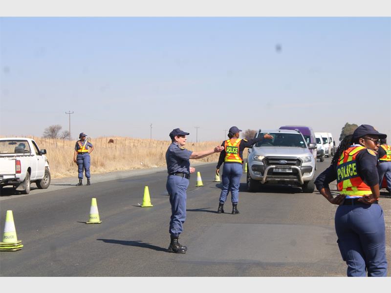 police women pull over vehicles to search