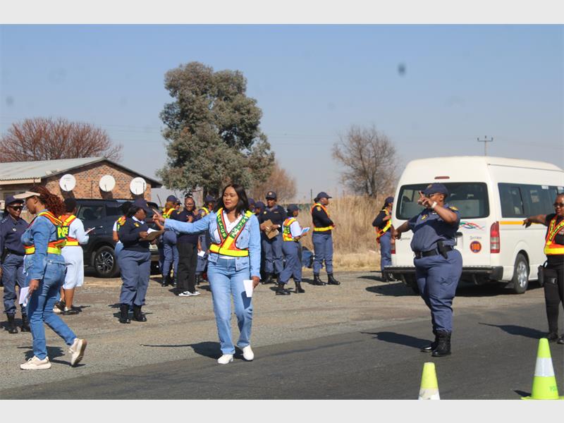 police women pull over vehicles to search