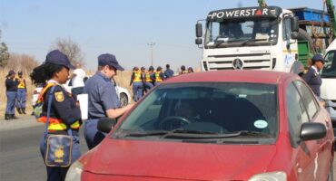 police women pull over vehicles to search