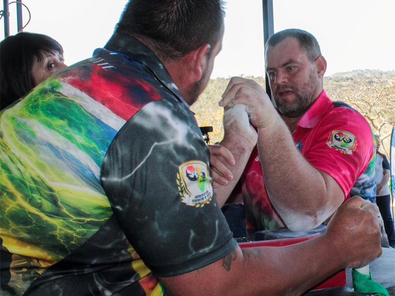 two men arm wrestle