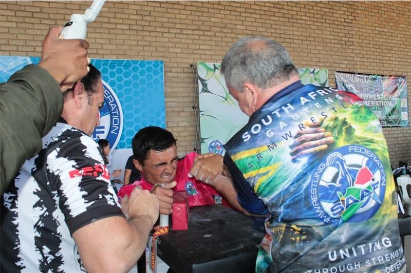 two men arm wrestle