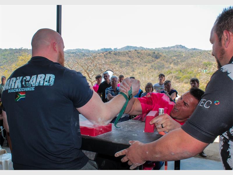 two men arm wrestle