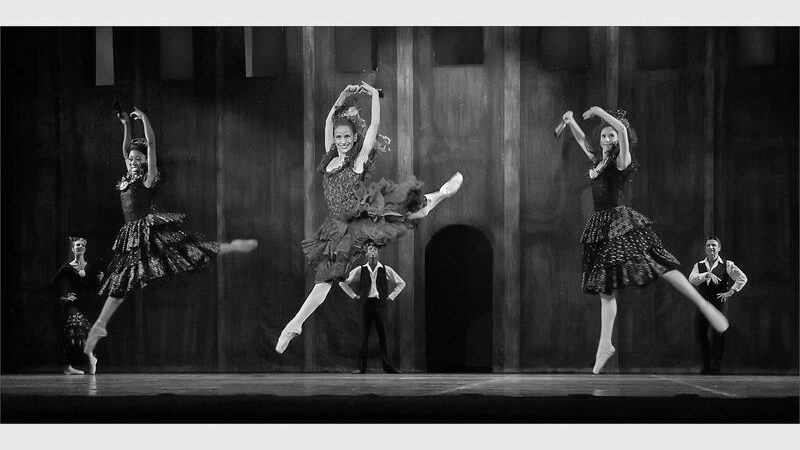 A black and white image of ballet dancers