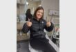 woman shows thumbs up