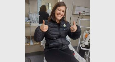 woman shows thumbs up