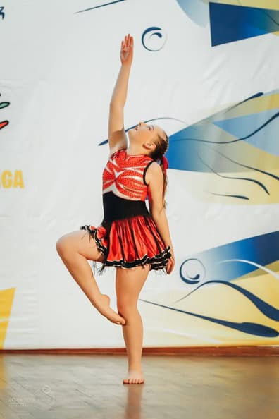 girl in red and black dancing