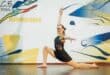 a dancer in front of a dance wall