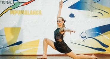 a dancer in front of a dance wall