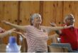 a woman opens her arms wide