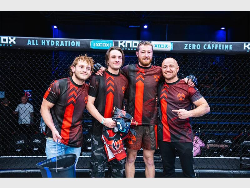 three fighters and their coach