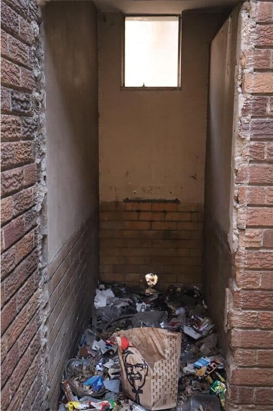 Rubbish strewn everywhere inside a building