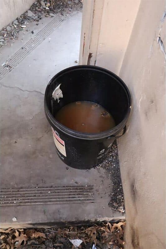 a bucket is used as a toilet