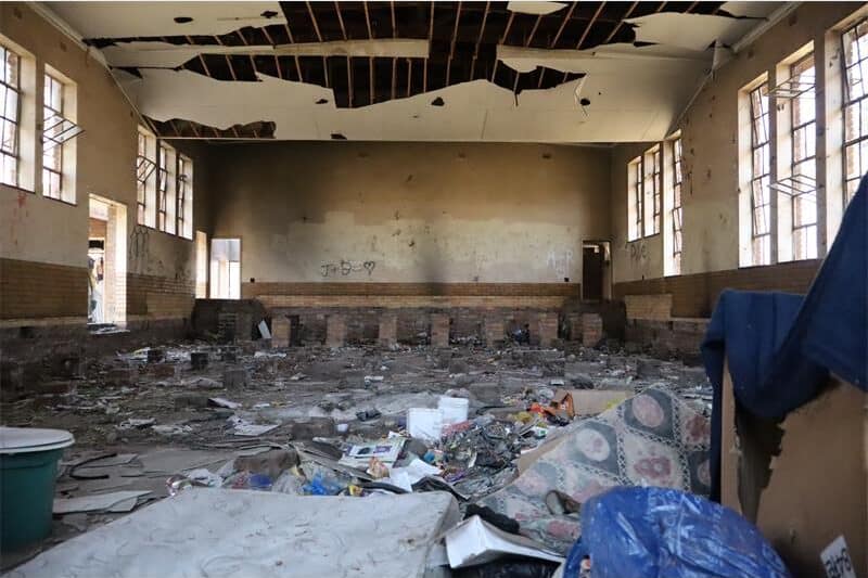 a hall is vandalised and dirty