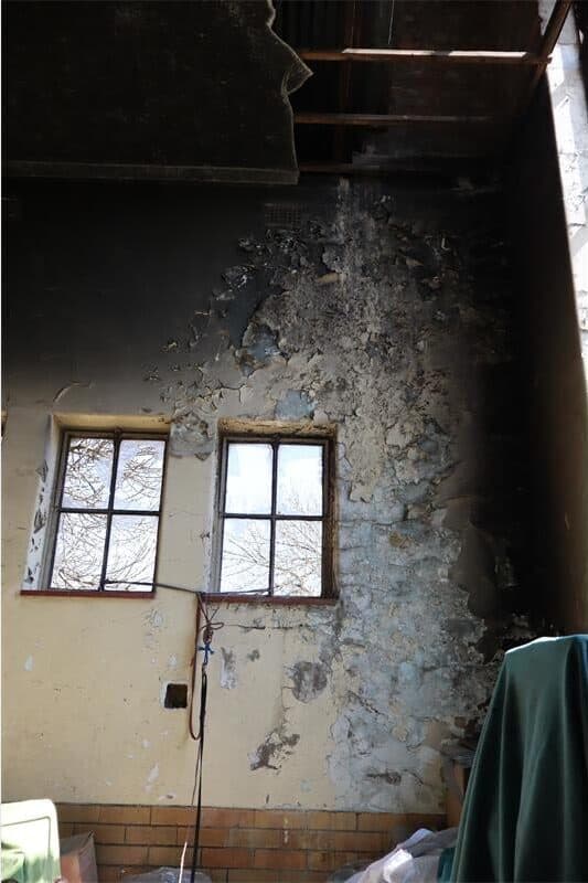 a fire made inside the building damaged the walls