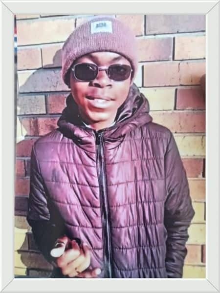 young man with sunglasses and a purple jacket