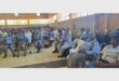 many people sitting in a hall