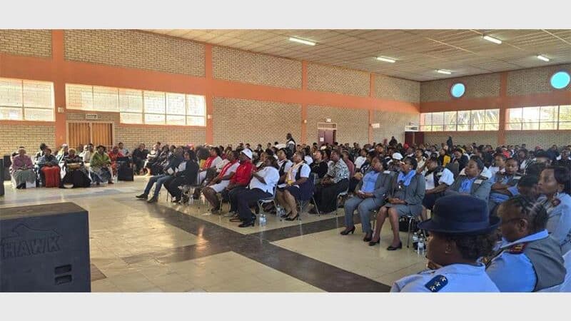 people sitting in a hall
