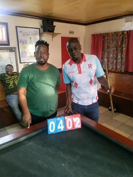 Two men at a pool table