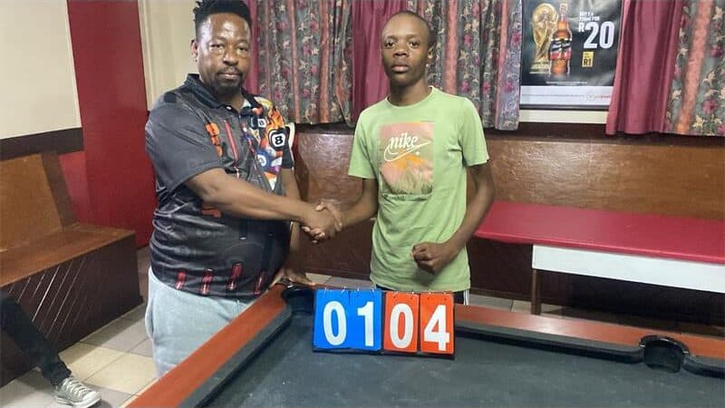 Two men at a pool table