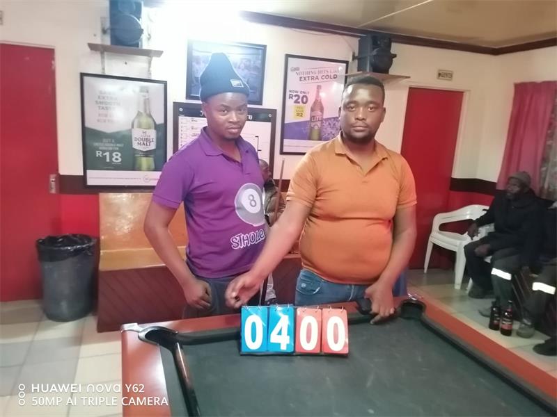Two men at a pool table