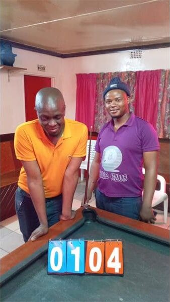 Two men at a pool table