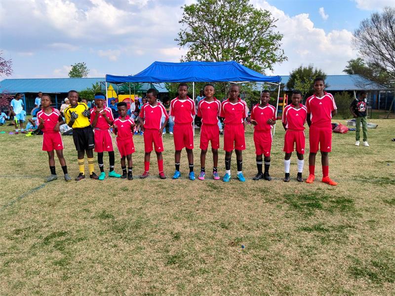 a soccer team in red kit