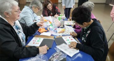 women make christmas cake decorations