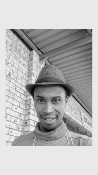 black and white image of a man with a hat