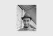 black and white photo of a man with a hat