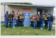 a group of people in front of a police station