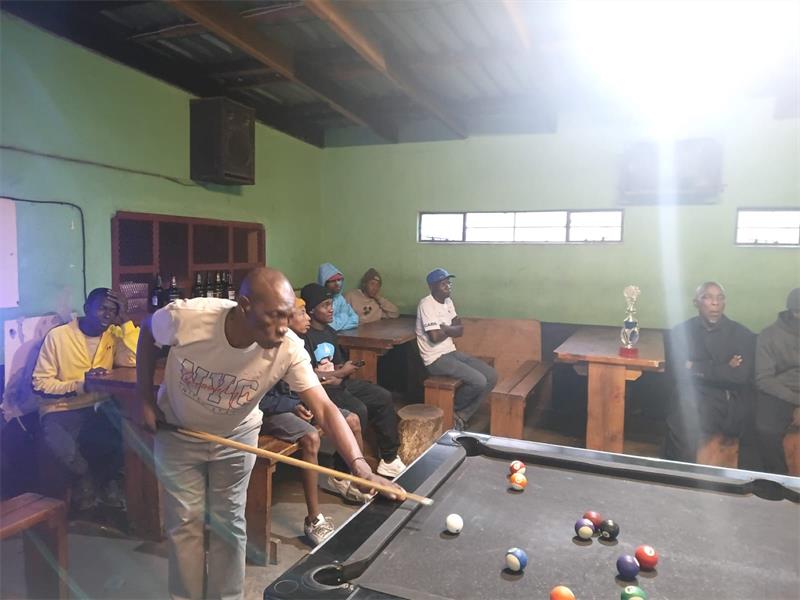 man at a pool table