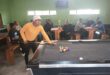 man at a pool table