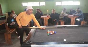 man at a pool table