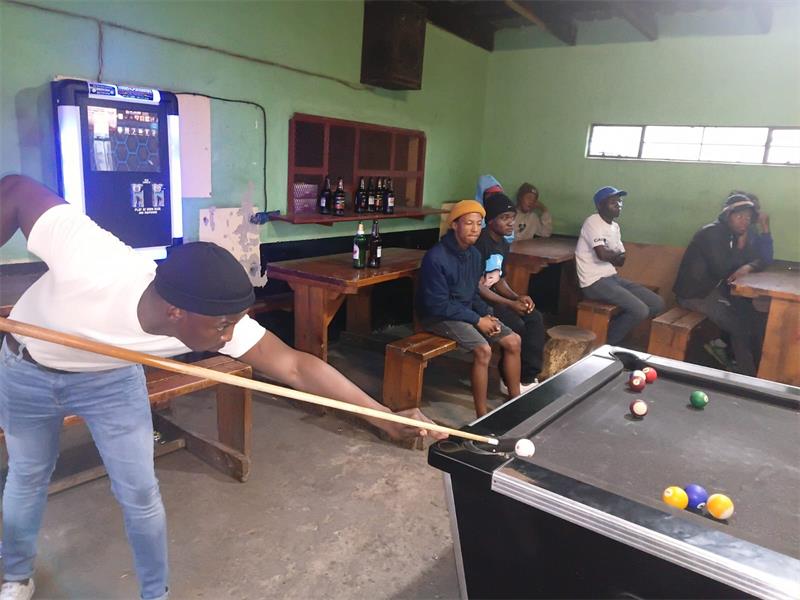 man at a pool table