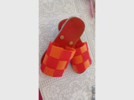 orange sandals out of trash
