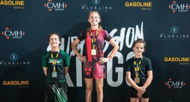 three girls on a podiu,