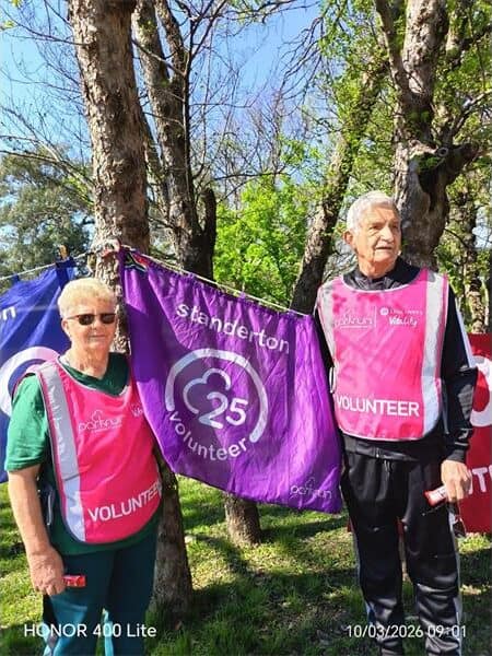 couple with a purple banner